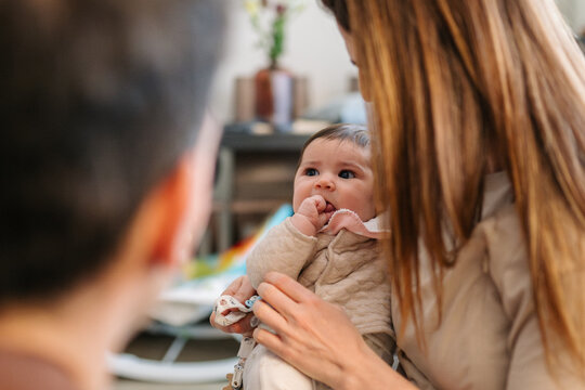 Parents bonding with baby at home