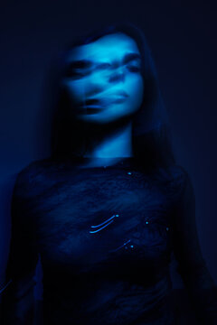 Movement captured in blue light during a creative session