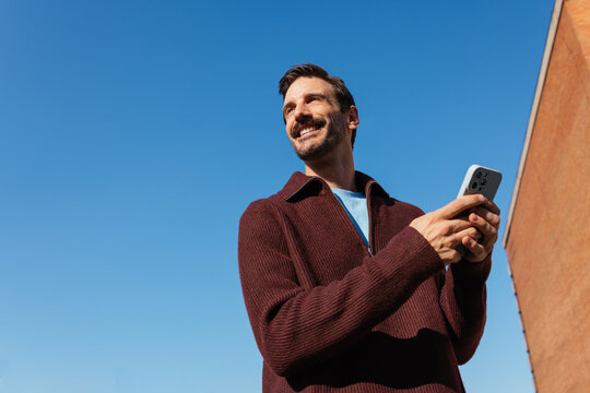 Smiling man with phone