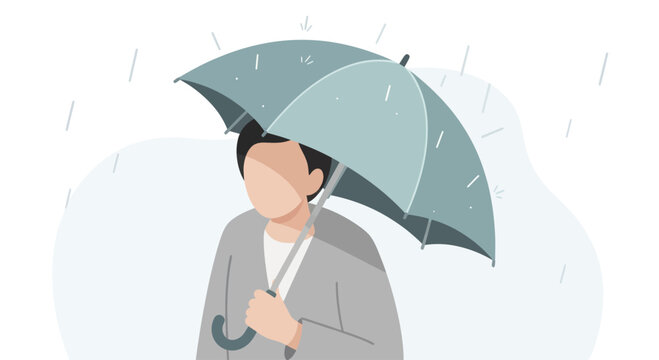 Person holding an umbrella during rainfall.