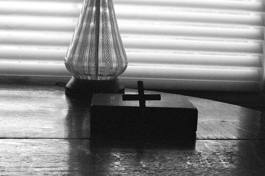 Black and White Image of Bible and Cross