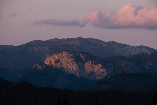 Misty mountain landscape at sunrise with dramatic light.