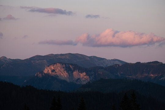Misty mountain landscape at sunrise with dramatic light.