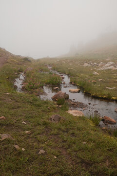 Foggy Morning at a Small Stream in the Mountains