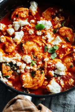 Shrimp saganaki with tomato sauce and feta
