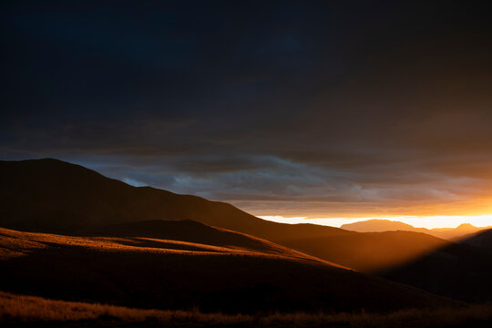 Striking Golden Sunset Light Illuminating Mountain Valley