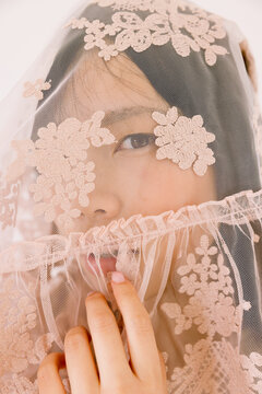 Face Concealed Behind Floral Veil