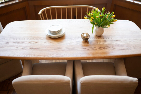 Table Setting With Flowers and Plates in a Dining Area