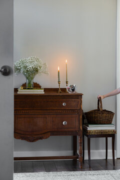Entryway of home with hand grabbing basket