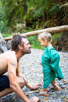 baby and papa at the river