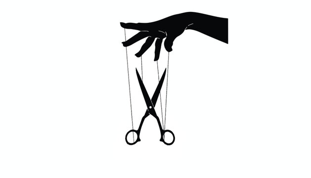 Silhouette of a hand controlling scissors like a puppet with black and white scissors manipulation abstract metaphor decision management