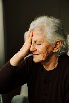Portrait of senior woman with her hand on her face