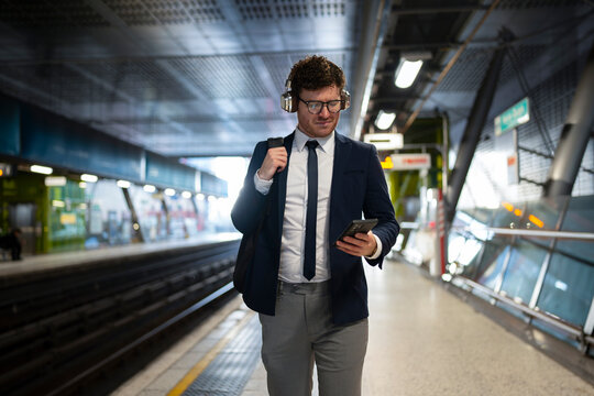 Businessman at train station
