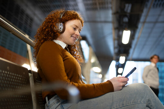 Waiting for train, music on
