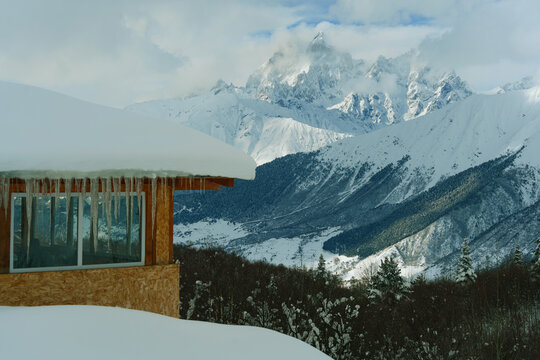 The hut on ski resort overlooking the mountains in winter 