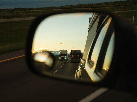 View of the traffic through rear view mirror 