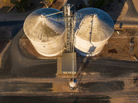 Looking down onto the tops of grain silos along a railway siding