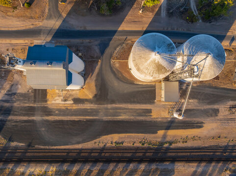 Looking down onto the tops of grain silos along a railway siding