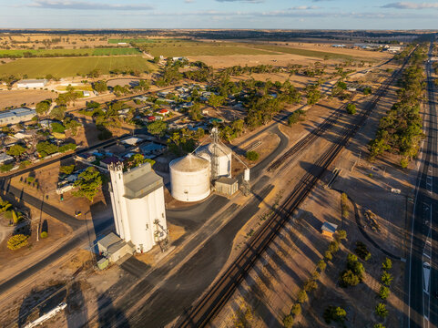 Grain silos along railway lines running through a country town