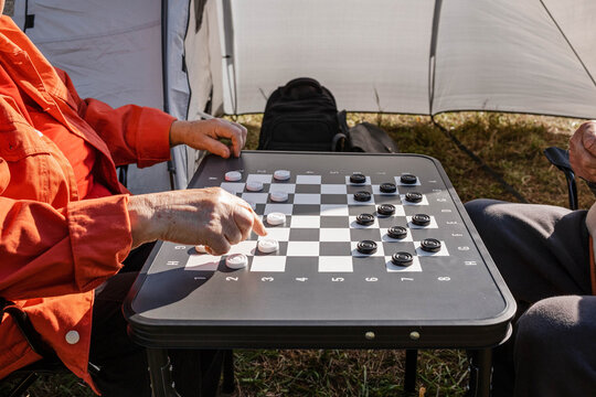 Playing checkers during the day.