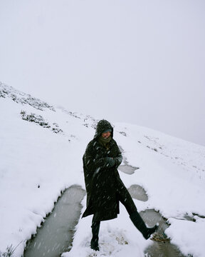Woman enjoying the snowfall