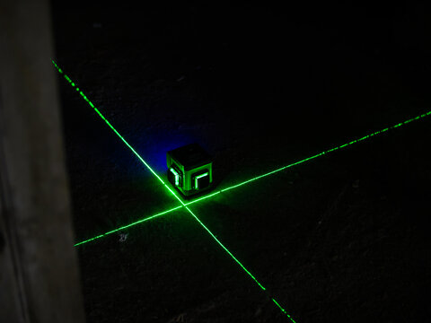 Green Laser Level on Concrete Floor