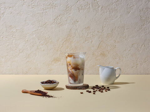 Iced Coffee With Cream in Elegant Setting Featuring Coffee Beans