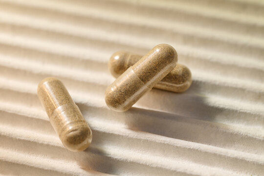 Three herbal capsules present a natural remedy for health