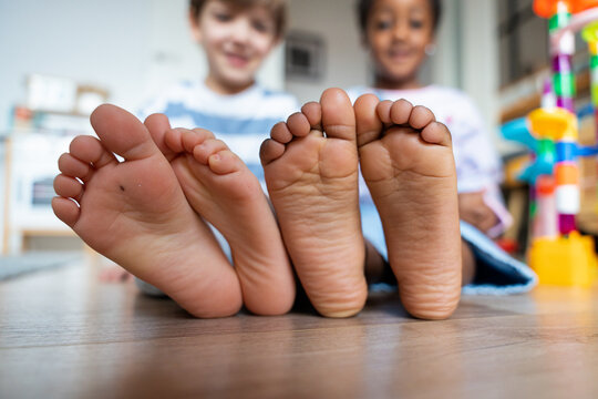 Children showing feet concepts of friendship and diversity