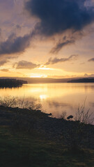 Obraz premium Dramatic Sunset over Kielder Reservoir, Kielder, Northumberland April 2026. 