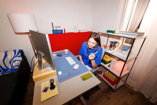 Business woman working from home at office desk with computer
