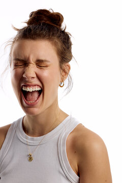 Woman laughs out loud in studio