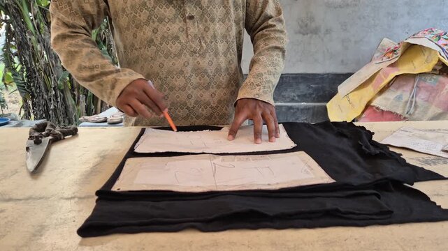 Tailor Marking Fabric with Pen Using Pattern Board Template for Garment Cutting