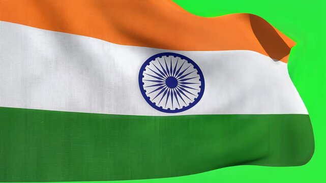 The Indian flag waving against a green background with vibrant orange, white, and green colors.