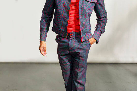 Man Walks in Modern Outfit 