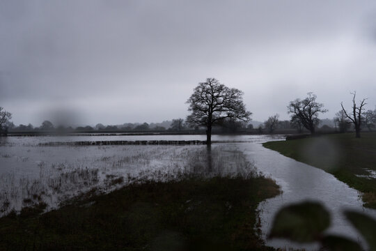 Blurred raindrops and Floods in the countryside on a stormy day. 
