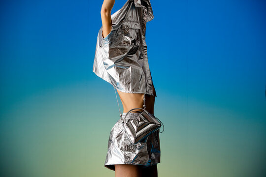 Silver Metallic Outfit Model In Futuristic Style