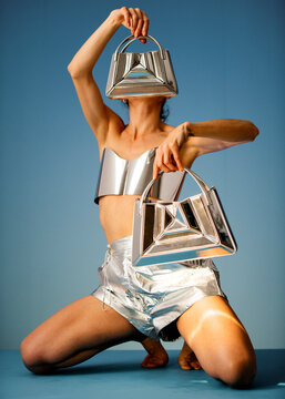 Futuristic Silver Bags Model in Metallic Outfit