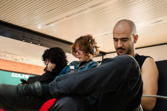 People Waiting at an Airport for Their Flight in the morning