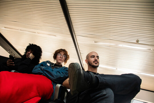 People Waiting at an Airport for Their Flight in the morning