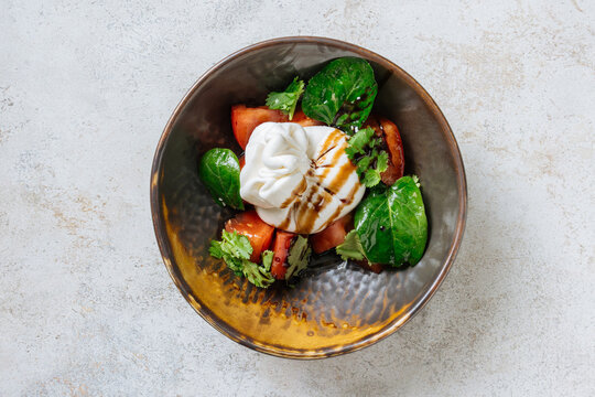 Burrata and tomato salad with balsamic glaze