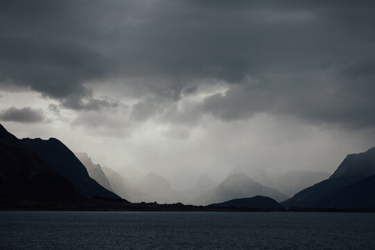 Lofoten islands landscape with moody clouds over fjord