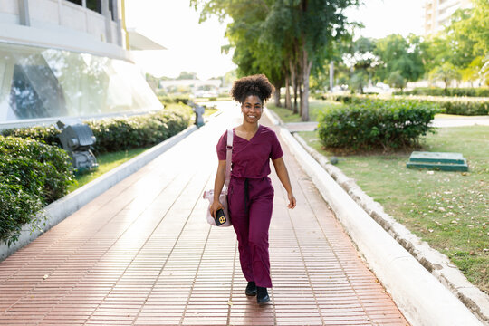 Health Worker Walking in Park During Afternoon Hours