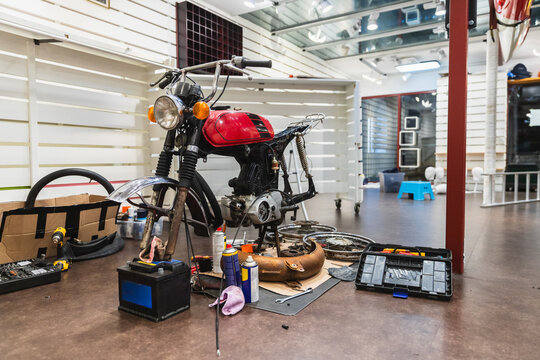 Vintage Red Motorcycle Undergoing Restoration