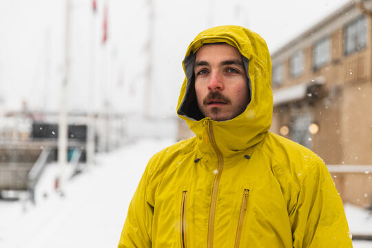Portrait of a Determined Man in Yellow Winter Gear Outdoors