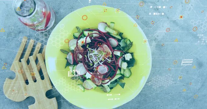 Camera pulling back, revealing yellow salad bowl on tabletop, overlays tagging salad for food ads