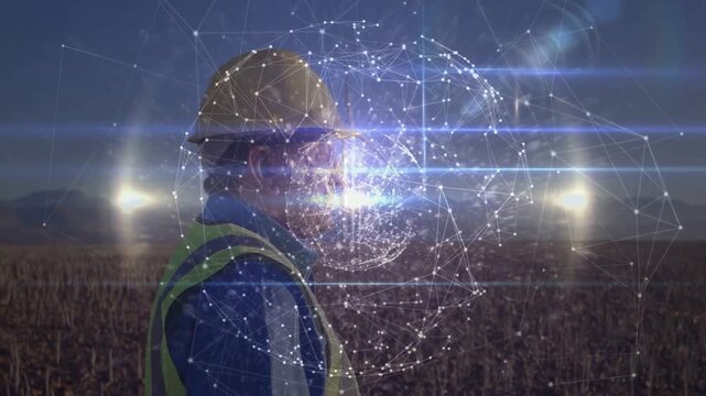 Hologram materializing over face, field worker in hard hat facing, globe rotating showing crop data