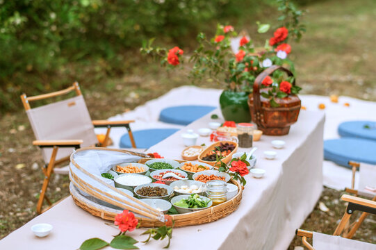 Closeup of Chinese food at an outdoor picnic table in the countryside