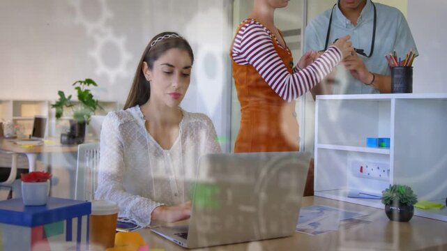 Seated woman typing on PC as colleagues handing device and inspecting for health tech, animated UI