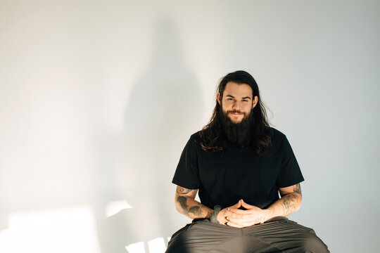 Portrait of smiling man with long hair